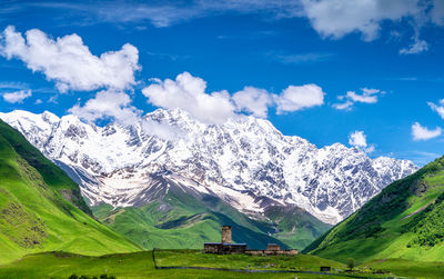 Scenic view of snowcapped mountains against sky