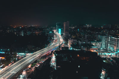 High angle view of illuminated city buildings at night