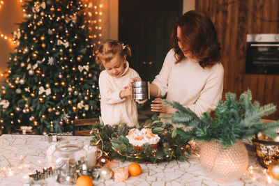 Woman blowing christmas tree