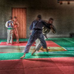 Full length of woman standing by railing