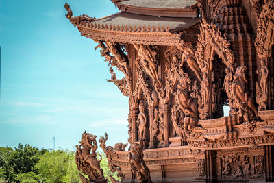 Carvings on temple against sky