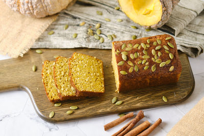 High angle view of cake on cutting board