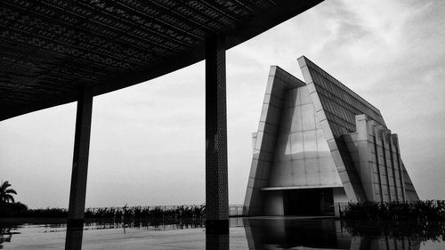 Modern building against cloudy sky