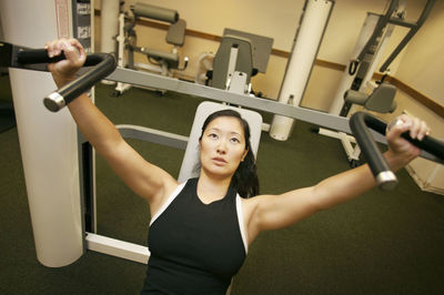 High angle view of woman exercising in gym