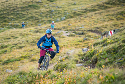 Man riding bicycle on mountain