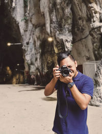 Man photographing with camera