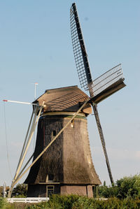 Traditional windmill against clear sky