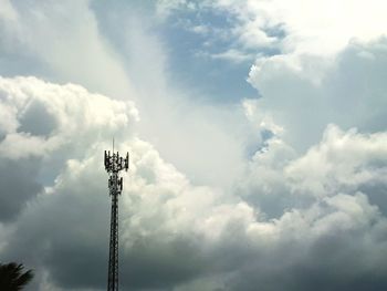 Low angle view of communications tower against sky
