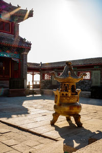 Statue in temple against clear sky