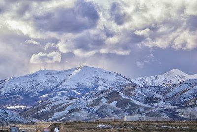 Oquirrh mountain range snow capped, bingham canyon mine kennecott copper mine salt lake utah. usa.