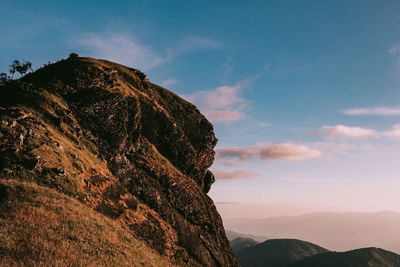 Low angle view of rock formation against sky