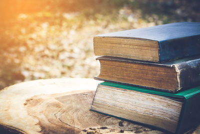 Ancient books on a wooden table , literacy and knowledge concept