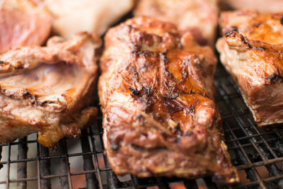 Close-up of meat on barbecue grill