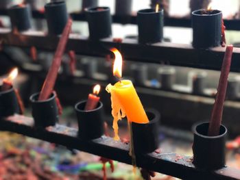 Close-up of burning candles