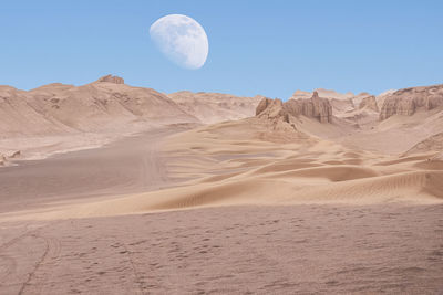 Scenic view of desert against clear sky