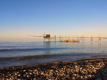 Trabocco, antique fishing equipment. scenic view of sea against clear sky.  