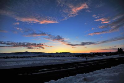 Scenic view of beach against sky during sunset