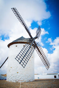 Low angle view of traditional windmill against clear sky