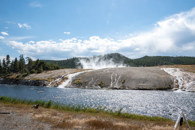 Scenic view of firehole river in midway geyser at yellowstone park in summer