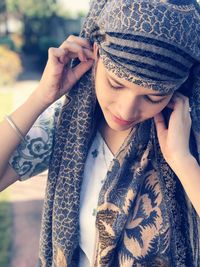 Close-up of woman wearing scarf outdoors