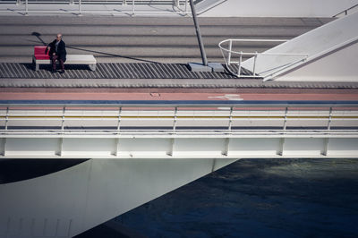 High angle view of people walking on staircase