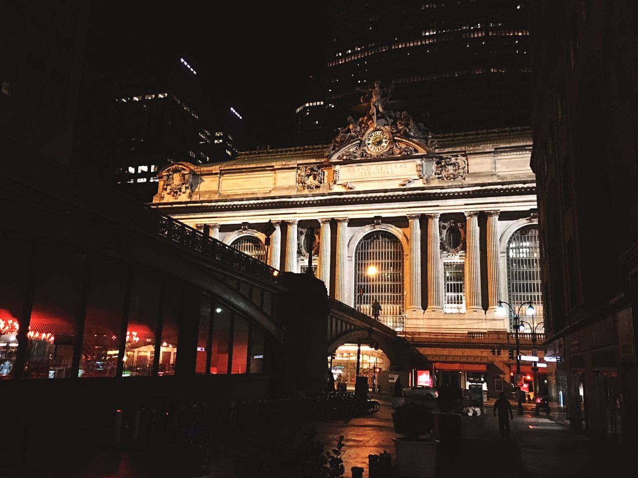 night, illuminated, architecture, built structure, building exterior, transportation, travel destinations, travel, city, arch, architectural column, incidental people, famous place, city life, mode of transport, lighting equipment, low angle view, street, tourism, car