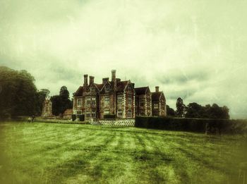 Castle on field against sky