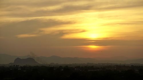 Scenic view of dramatic sky during sunset