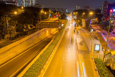 High angle view of light trails on road at night