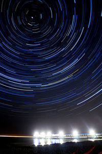 Low angle view of illuminated sky at night