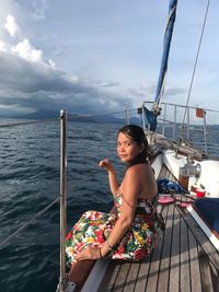 Portrait of woman sitting in boat on sea