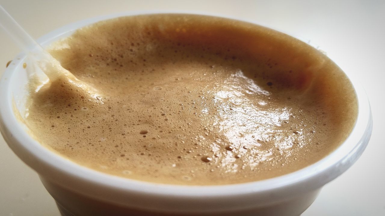 food and drink, drink, refreshment, freshness, close-up, indoors, coffee cup, still life, frothy drink, healthy eating, coffee - drink, coffee, cup, beverage, spoon, no people, high angle view, directly above, selective focus, table