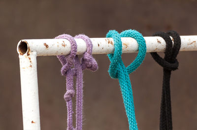 Close-up of rope tied up on rusty metal