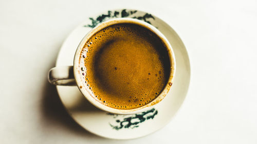 High angle view of coffee cup on table