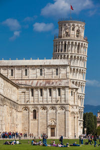 Group of people in front of historical building