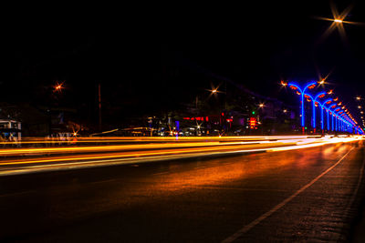 Light trails on city street at night