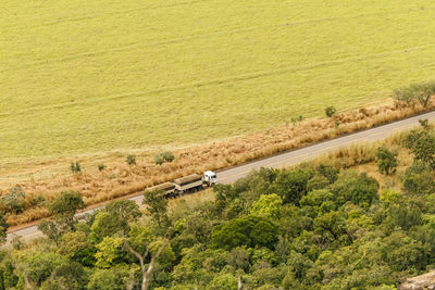 High angle view of road amidst green landscape