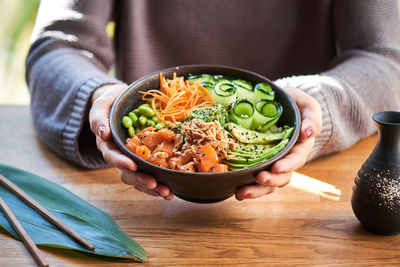 Midsection of woman preparing food