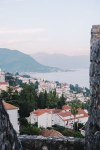 High angle view of townscape and mountains against sky