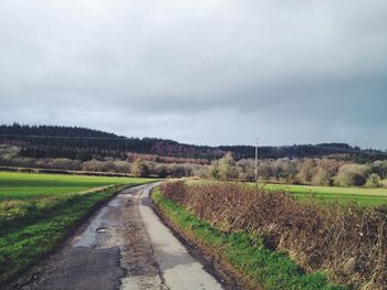 Road passing through field