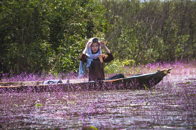 Woman with flowers in water