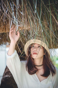 Close-up of woman touching roof