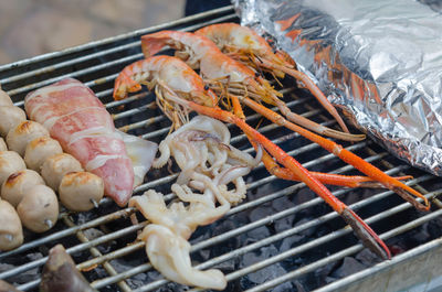 Close-up of meat on barbecue grill