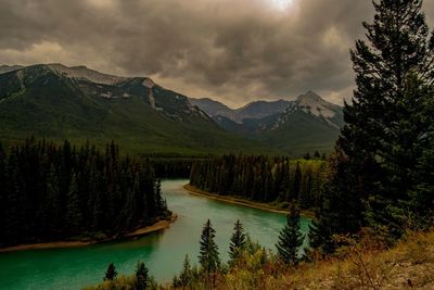 Scenic view of lake and mountains against sky
