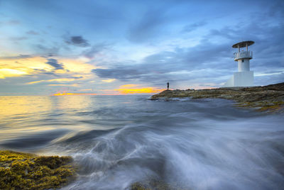 Blurred motion of sea against sky during sunset