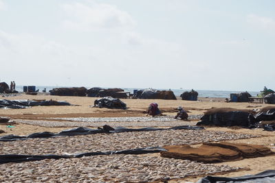 Man working against sky