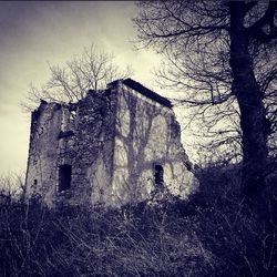 Abandoned building against sky