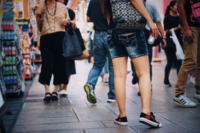 Low section of people standing on floor