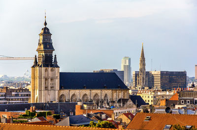 View of buildings in city against sky
