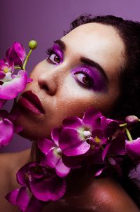 Close-up of beautiful woman with orchids flowers